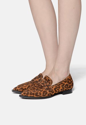 Leopard print loafers made of soft suede with a low heel, featuring a wide strap across the upper and rounded toe design.