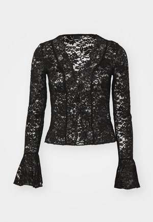 Black lace top featuring a V-neckline, long sleeves with flared cuffs, and a floral pattern throughout. Elegant and sheer.