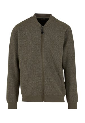 Olivgrünes Jäckchen aus strukturiertem Stoff, mit Reißverschluss und gerippten Bündchen. Hat einen runden Kragen und ein dezentes geometrisches Muster.