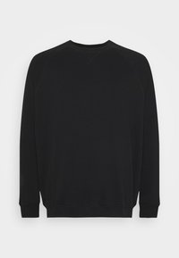 Felpa nera con collo a giro, maniche lunghe e polsini a coste. Tessuto morbido senza motivi o loghi visibili. Design semplice e minimalista.