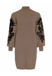 Robe en tricot couleur beige, avec un col montant et des manches longues ornées de broderies florales noires. Texture lisse et poignets ajustés.