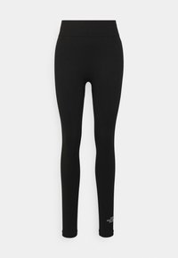 Leggings neri realizzati in tessuto elastico. Vita alta, design aderente e un piccolo logo bianco sulla gamba sinistra, in basso.