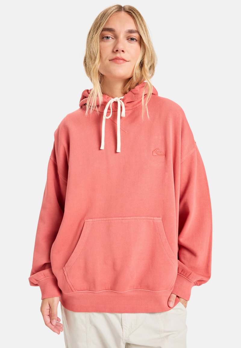 Pink hoodie made of soft, textured fabric. Features a drawstring hood, kangaroo pocket, and ribbed cuffs. Subtle logo on chest.