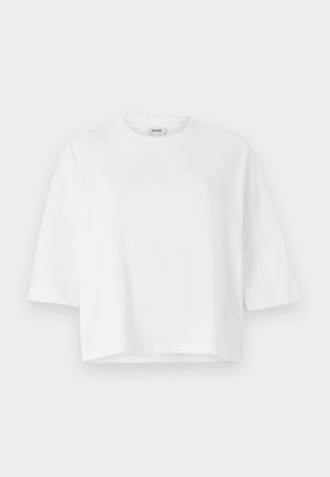 Valkoinen lyhythihainen t-paita, jossa on pyöreä kaula-aukko, valmistettu pehmeästä puuvillasta. Yksinkertainen muotoilu, ei kuvioita tai koristeita.