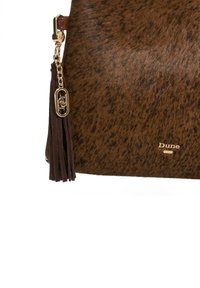 Brown speckled handbag with soft, textured fur, featuring a gold hardware tassel and the brand name "Dune" embossed on the side.