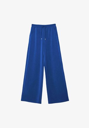 Blaue Hosen mit weitem Bein, elastischem Bund und Kordelzug, mit Seitentaschen, flach auf weißem Hintergrund liegend.