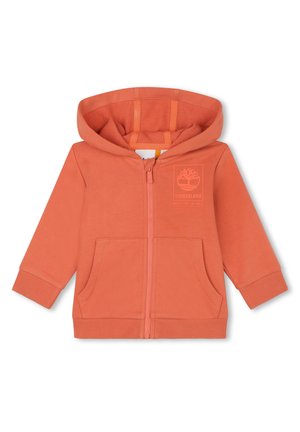 Hoodie zippé orange en tissu doux, avec une poche avant, des poignets côtelés et un design de logo sur la partie gauche de la poitrine.