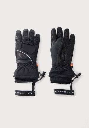 Двойка черни зимни ръкавици Oakley с регулируеми презрамки на китката и текстурирани подложки за захващане от дланта, показани на бял фон.