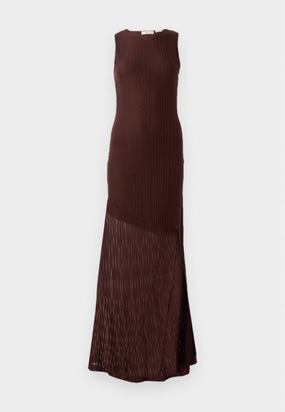 Brown knitted dress with a sleeveless design, featuring a ribbed texture and a sheer, patterned bottom panel, falling to ankle length.