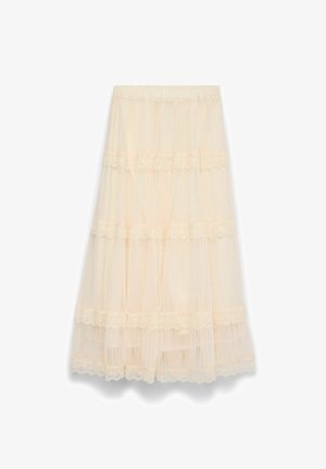 Večplastna tulna krilo v svetlo bež barvi z čipkasto obrobo. Ima elastičen pas in tekočo zasnovo z več plastmi za dodatno gibanje.