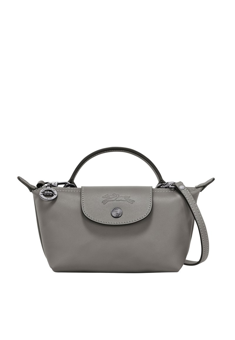 Grey leather handbag with rounded shape, small handle, and removable shoulder strap. Features a button closure and embossed logo.