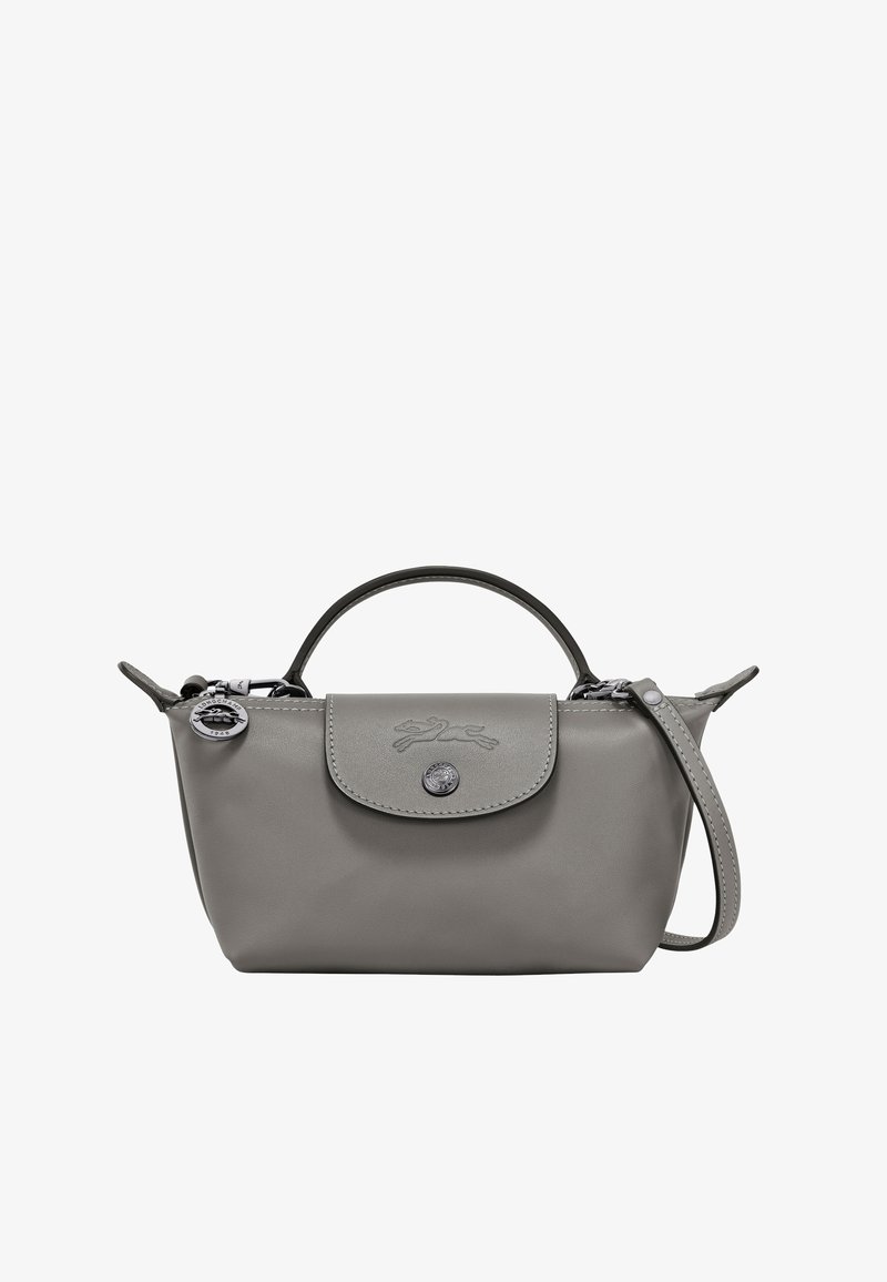 Grey leather handbag with rounded shape, small handle, and removable shoulder strap. Features a button closure and embossed logo.