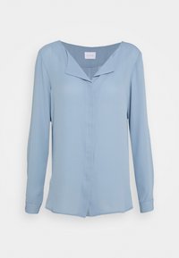 Blouse bleu clair à manches longues avec un col en V sans col, une fermeture à boutons et une texture lisse. Dispose d'un ourlet droit et de fentes latérales.