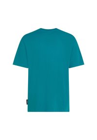 Camiseta de algodón verde azulado con cuello redondo y mangas cortas. Diseño liso, corte holgado, con una pequeña etiqueta de logo en el lateral.