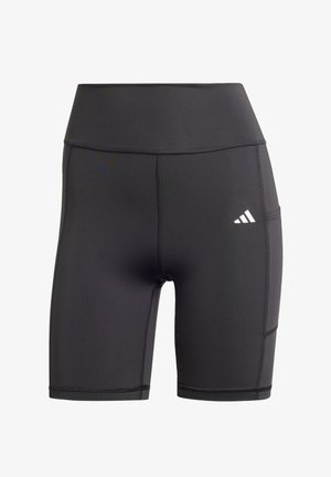 Sorte idrettsshorts laget av stretchy materiale, med høy midje, flate sømmer, og en hvit logo på venstre hofte.