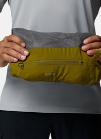 Hands holding a folded green and gray packable jacket with a zippered pocket and "PACKABLE" label on the front.