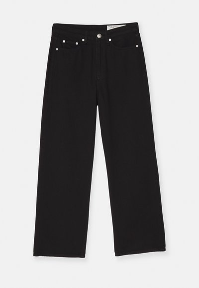 Mustad mustad joodid, mis on valmistatud denimist, viie taskuga disainiga, nuppude kinnitusega ja metallist riistvaraga aktsentidega. Tekstureeritud kangas sujuva viimistlusega.