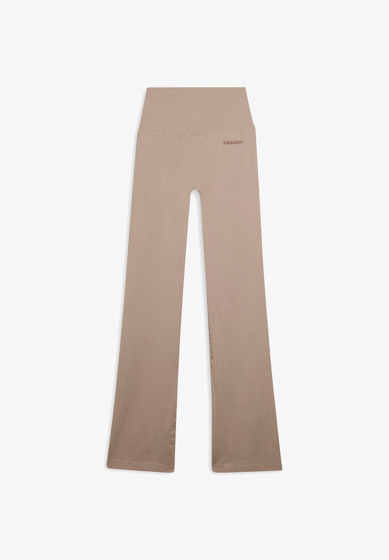 Pantaloni yoga beige con una ampia vita elastica, fondo svasato e tessuto liscio. Logo "FREDDY" stampato in modo discreto sul retro.