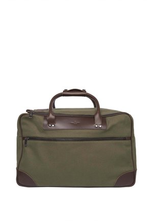 Olive green canvas bag with brown leather accents, zipper pocket in front, dual leather handles, and a rectangular shape.