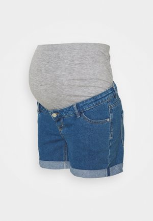Calças de maternidade com um design em denim azul, com bainha dobrada e um painel abdominal cinza elástico para conforto e suporte.