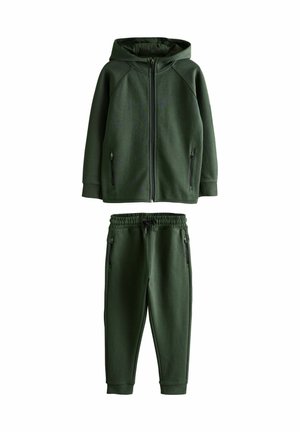 Grüne Zip-Hoodie mit Kapuze und Reißverschlusstaschen, kombiniert mit passenden Jogginghosen mit elastischem Bund und Taschen.