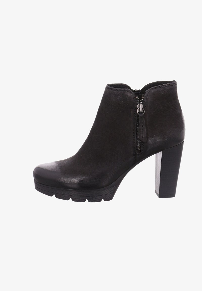Bottine en cuir noir avec fermeture éclair latérale, talon haut épais et semelle crantée pour une meilleure adhérence, présentée sur fond blanc.