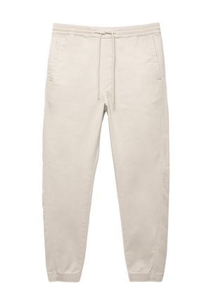 Beige cotton pants with an elastic waistband, drawstring, side pockets, and tapered legs. Smooth texture and minimalistic design.