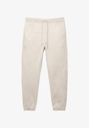 Beige katoenen broek met een elastische tailleband, trekkoord, zijzakken en taps toelopende pijpen. Glad textuur en minimalistisch ontwerp.