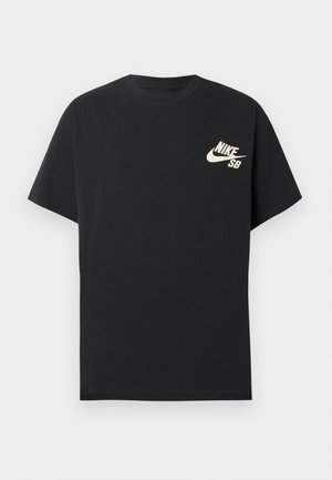 Μαύρο κοντομάνικο μπλουζάκι Nike SB με κρεμ λογότυπο στην αριστερή πλευρά του στήθους, με το λογότυπο Nike swoosh και το κείμενο "SB".