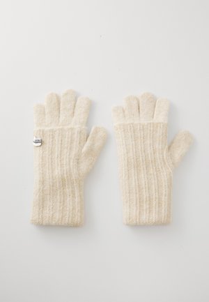 Gants tricotés beiges avec une texture côtelée, présentant un accent argenté au niveau du poignet. Design à cinq doigts pour plus de dextérité. Matériau doux.