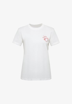 White short-sleeve t-shirt with a small red coffee cup illustration and the word "DAYDREAMING" above it on the left chest.
