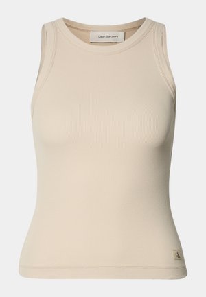 Canotta a coste beige con scollatura rotonda e design senza maniche. Presenta un'etichetta con il logo Calvin Klein Jeans sull'orlo. Texture morbida.