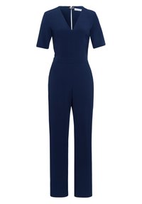 Jumpsuit blu navy con scollo a V, maniche corte e vita aderente. Presenta una chiusura zip sul retro e una silhouette a gamba larga. Texture liscia.