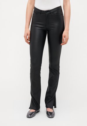 Black faux leather pants with a slim fit, featuring a mid-rise waist, stitched detailing, and split hems at the ankles.