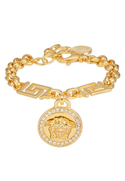 Gold chain bracelet featuring a lion medallion surrounded by clear rhinestones, with geometric links and a lobster clasp closure.