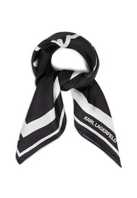 Foulard en soie noir et blanc plié, présentant de larges rayures géométriques et la marque "KARL LAGERFELD" à une extrémité.