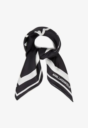 Czarny i biały jedwabny szal złożony, z wyraźnymi geometrycznymi paskami i oznaczeniem "KARL LAGERFELD" na jednym końcu.
