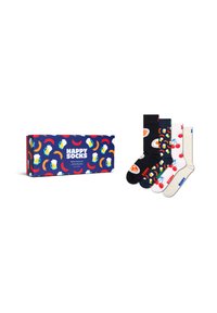 Cztery kolorowe skarpetki z wzorami przedstawiającymi śniadania i owoce obok pasującego pudełka prezentowego z napisem "Szczęśliwe Skarpetki", na którym znajdują się wzory przedstawiające piwo, kiełbasę i chili.