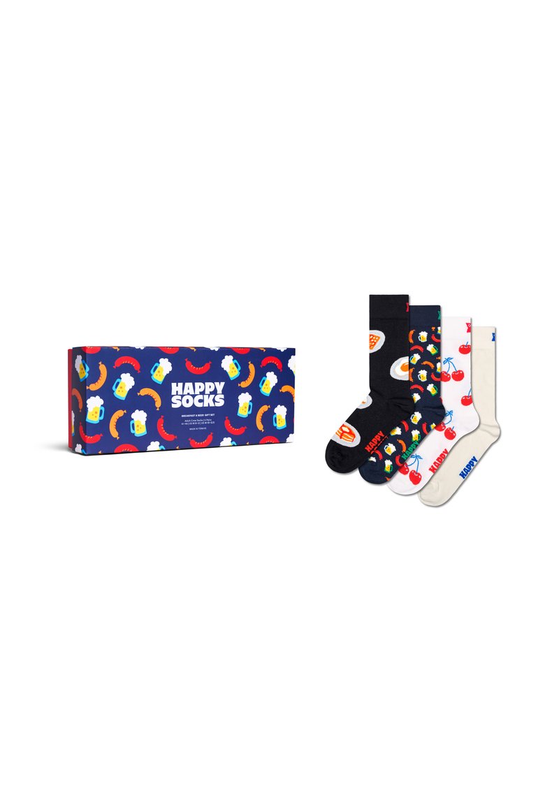 Cztery kolorowe skarpetki z wzorami przedstawiającymi śniadania i owoce obok pasującego pudełka prezentowego z napisem "Szczęśliwe Skarpetki", na którym znajdują się wzory przedstawiające piwo, kiełbasę i chili.