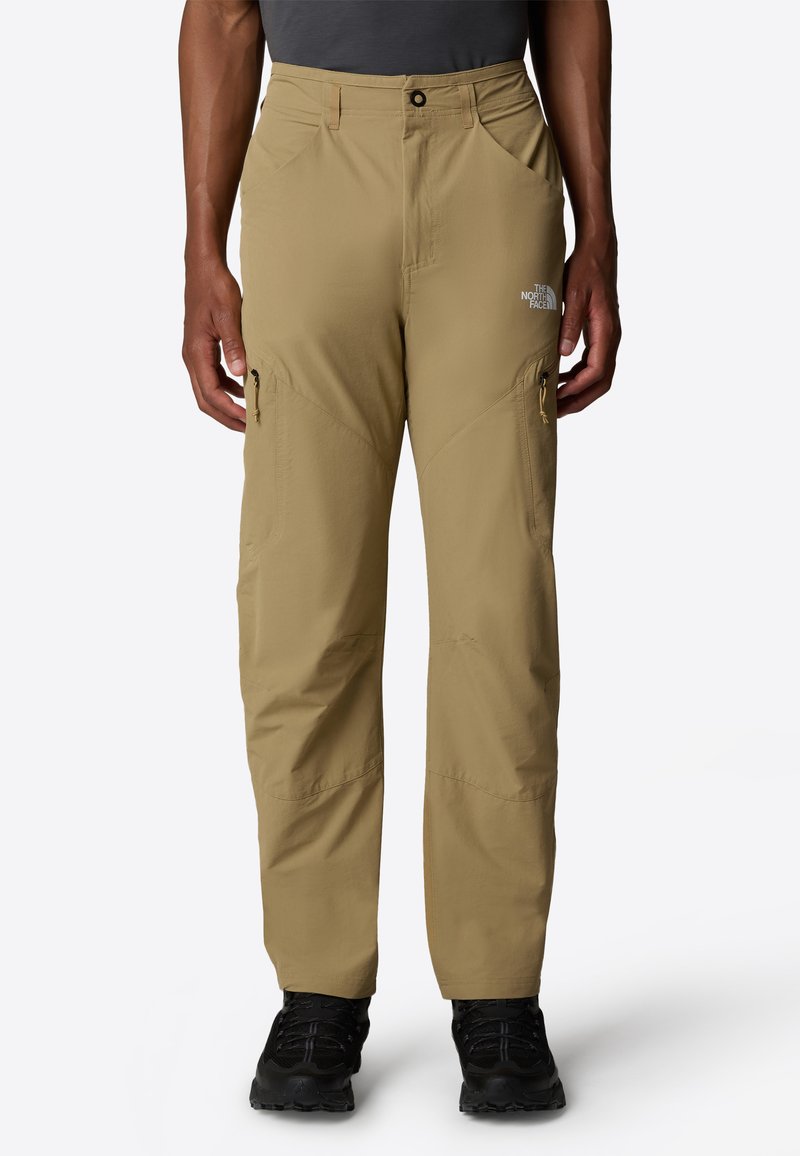 Beiga lätta vandringsbyxor med avslappnad passform, dragkedjefickor på sidan och förstärkta knän, med North Face-logotypen på vänstra låret.