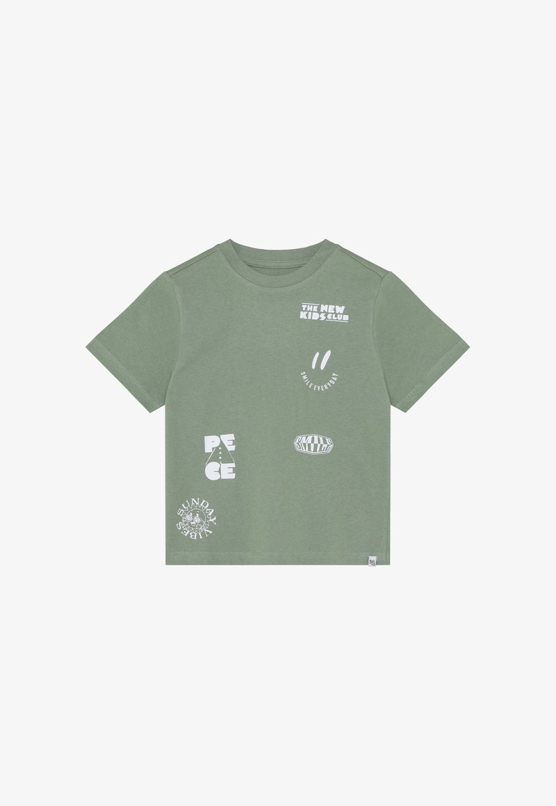 T-shirt en coton vert avec divers motifs graphiques blancs, incluant "PEACE", des visages souriants, et "SUNDAY LABELS", manches courtes et col rond.