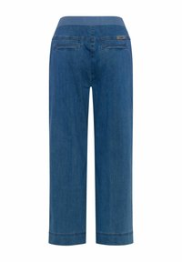 Pantalons larges en denim bleu avec taille élastique et deux poches passepoilées à l'arrière, présentés de dos sur fond blanc.