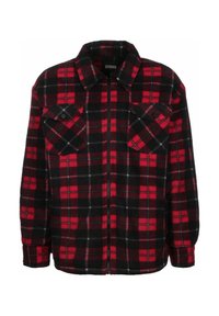 Veste-chemise en flanelle à carreaux rouges et noirs avec fermeture éclair à l'avant, deux poches poitrine, et col classique. Texture douce et manches longues.