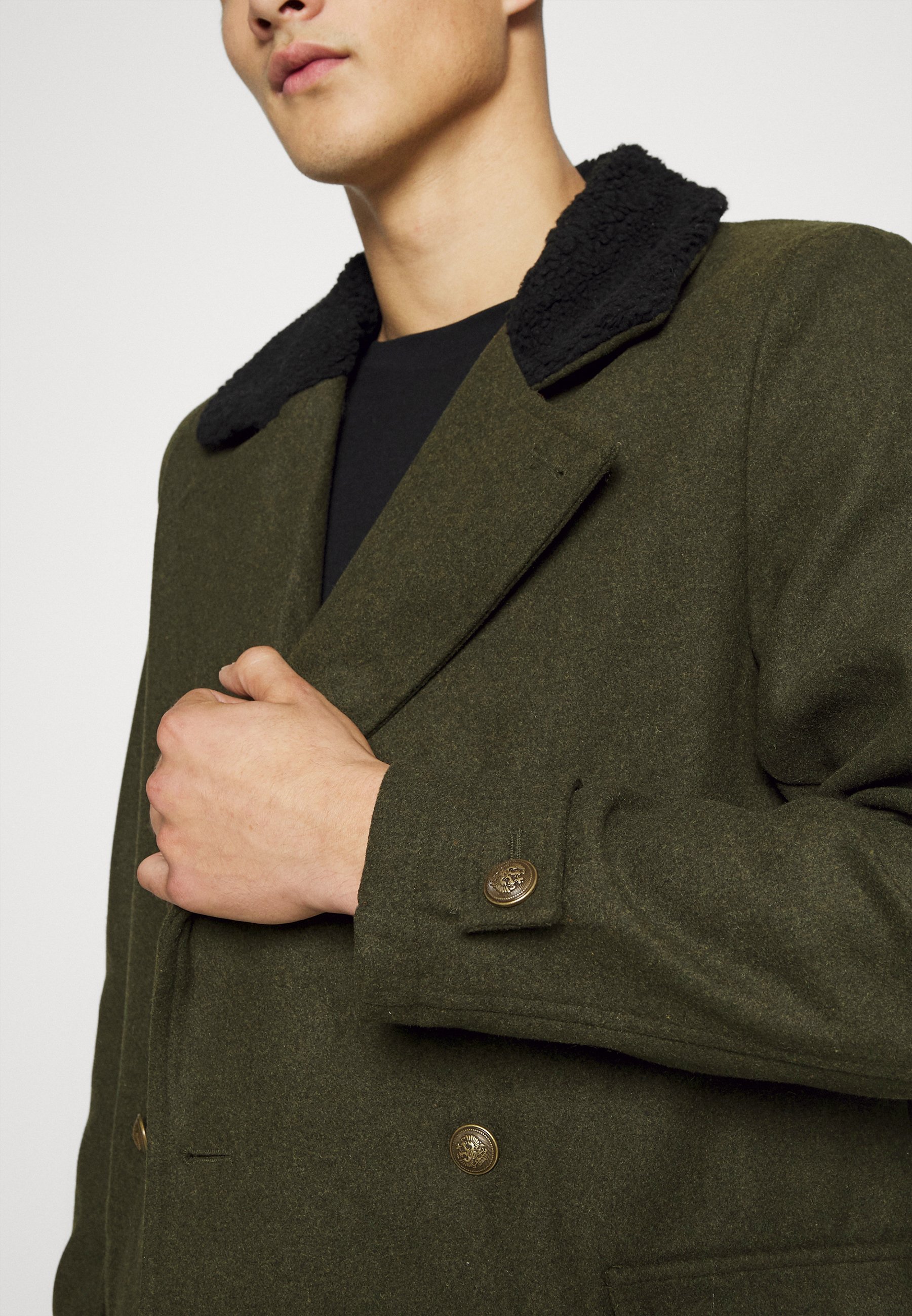 dark green military coat