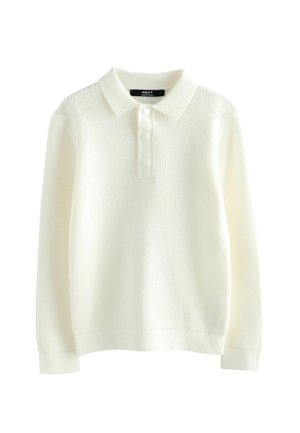 Polo a maniche lunghe bianco realizzato in tessuto a maglia testurizzata, con collo a camicia e patta con tre bottoni.