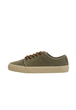 Olive green suede sneaker with a rounded toe, tan rubber sole, and brown laces. Features a textured side panel and a small brand label.