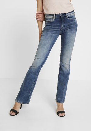 Vaqueros a campana - stone blue denim