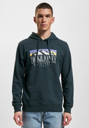 Dark green hoodie made of cotton, featuring a front graphic design with mountains and the text "JACK & JONES ORIGINALS 1990." Drawstring hood.