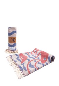 Rolled and folded peshtemal towels with red fish and blue wave patterns, featuring fringe edges and branded labels.