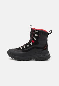 Black hiking boot with red accents, textured upper, metal eyelets, and a rugged sole for traction; waterproof design ideal for outdoor use.